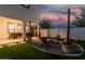 Backyard with fire pit, string lights, and covered patio at 11541 E Corbin Ave, Mesa, AZ 85212