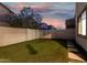 Backyard featuring well-maintained turf and privacy wall at 11541 E Corbin Ave, Mesa, AZ 85212