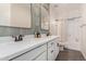 Elegant bathroom featuring double sinks with modern fixtures, quartz countertops, and a shower/tub combo at 11541 E Corbin Ave, Mesa, AZ 85212