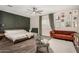 Inviting bedroom with decorative wall, cozy seating area, and stylish decor at 11541 E Corbin Ave, Mesa, AZ 85212