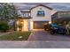Charming two-story home showcasing a well-kept lawn and paved driveway with a black Toyota truck at 11541 E Corbin Ave, Mesa, AZ 85212