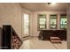 Covered patio with hot tub, fireplace and view of kitchen at 11541 E Corbin Ave, Mesa, AZ 85212