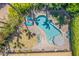 Aerial view of the backyard showcasing the pool, lounge areas, and landscaping, surrounded by lush greenery at 11822 S Coconino St, Phoenix, AZ 85044