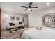 Cozy bedroom with neutral tones, ceiling fan, and stylish decor creating a relaxing atmosphere at 11822 S Coconino St, Phoenix, AZ 85044