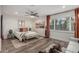 Bedroom featuring wood-look floors, ceiling fan and plenty of natural light from the window at 11822 S Coconino St, Phoenix, AZ 85044