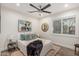 Comfortable bedroom with natural light, ceiling fan, and decorative accents for a peaceful retreat at 11822 S Coconino St, Phoenix, AZ 85044