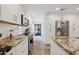 Well-equipped kitchen with stainless steel appliances, white cabinetry, and ample counter space at 11822 S Coconino St, Phoenix, AZ 85044