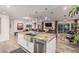 Open-concept design with a view of kitchen and living spaces, featuring a granite island at 11822 S Coconino St, Phoenix, AZ 85044