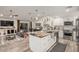 Open kitchen and living room design, showcasing a large island with a stainless steel sink at 11822 S Coconino St, Phoenix, AZ 85044