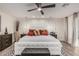 Comfortable primary bedroom featuring a custom accent wall, neutral decor, and plenty of space at 11822 S Coconino St, Phoenix, AZ 85044