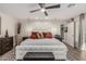Comfortable primary bedroom featuring a custom accent wall, neutral decor, and closet access at 11822 S Coconino St, Phoenix, AZ 85044