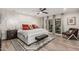 Spacious primary bedroom featuring a stylish accent wall, plush rug, and sliding door access to the patio at 11822 S Coconino St, Phoenix, AZ 85044