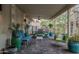 Covered patio with comfortable seating and well-placed plants offering a relaxing outdoor living space at 11822 S Coconino St, Phoenix, AZ 85044