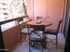 Outdoor balcony area with a round table and four chairs, perfect for relaxing at 12222 N Paradise Village S Pkwy # 325, Phoenix, AZ 85032