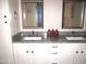 Elegant bathroom featuring double sinks and a granite countertop at 12222 N Paradise Village S Pkwy # 325, Phoenix, AZ 85032