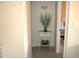 Hallway with a table and a decorative flower arrangement at 12222 N Paradise Village S Pkwy # 325, Phoenix, AZ 85032