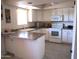 Functional kitchen with modern appliances and a convenient island at 12222 N Paradise Village S Pkwy # 325, Phoenix, AZ 85032