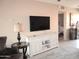 Cozy living room with a large TV, stylish furniture, and neutral decor at 12222 N Paradise Village S Pkwy # 325, Phoenix, AZ 85032