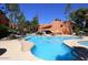Beautiful community pool area featuring an impressive rock waterfall and lounge seating at 12222 N Paradise Village S Pkwy # 325, Phoenix, AZ 85032