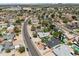 An aerial view shows many houses in the neighborhood, with wide streets at 13207 N 55Th Ave, Glendale, AZ 85304