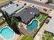 Aerial view of landscaped backyard with swimming pool and outdoor seating at 13207 N 55Th Ave, Glendale, AZ 85304
