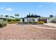 Charming single-story home featuring a pergola, brick accents, and well-maintained landscaping at 13207 N 55Th Ave, Glendale, AZ 85304