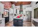 Newly renovated kitchen with white cabinets, subway tile backsplash, stainless steel appliances, and a center island at 13207 N 55Th Ave, Glendale, AZ 85304