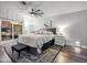 Inviting main bedroom with a ceiling fan, large window, and stylish decor at 13207 N 55Th Ave, Glendale, AZ 85304