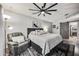 Serene main bedroom featuring a ceiling fan, slider door, and comfortable seating area at 13207 N 55Th Ave, Glendale, AZ 85304