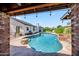 Scenic backyard pool surrounded by well-manicured greenery and an inviting outdoor space at 13207 N 55Th Ave, Glendale, AZ 85304