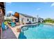Backyard pool with blue water, blue outdoor furniture and white house, great for entertaining friends and Gathering at 13207 N 55Th Ave, Glendale, AZ 85304