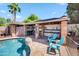 Outdoor pool-side bar area with seating and a welcoming ambiance, perfect for summer gatherings at 13207 N 55Th Ave, Glendale, AZ 85304