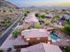 Aerial view of a home with a private backyard featuring a pool, mountain views and desert landscaping at 14056 E Desert Cove Ave, Scottsdale, AZ 85259