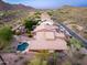 Aerial view of a home with a private backyard featuring a custom pool and desert landscaping at 14056 E Desert Cove Ave, Scottsdale, AZ 85259