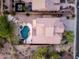 Aerial view of a home with a private backyard featuring a custom pool and spa at 14056 E Desert Cove Ave, Scottsdale, AZ 85259