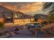 Spacious backyard with a pool, lush landscaping, and a mountain view creating a private oasis at 14056 E Desert Cove Ave, Scottsdale, AZ 85259