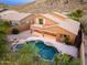 Inviting backyard pool and spa combo with stone accents and desert landscaping at 14056 E Desert Cove Ave, Scottsdale, AZ 85259