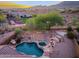 Aerial view of backyard with sparkling pool and well-maintained landscaping and fence at 14056 E Desert Cove Ave, Scottsdale, AZ 85259