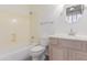 Cozy bathroom with tub-shower combo, vanity and neutral color palette at 14056 E Desert Cove Ave, Scottsdale, AZ 85259