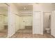 Contemporary bathroom features glass shower, linen closet and adjacent toilet at 14056 E Desert Cove Ave, Scottsdale, AZ 85259