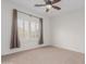 Bedroom features plush carpet, neutral paint, plantation shutters, and natural light at 14056 E Desert Cove Ave, Scottsdale, AZ 85259
