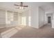 Bedroom featuring built-in shelving, carpeted floors and lots of natural light at 14056 E Desert Cove Ave, Scottsdale, AZ 85259