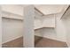 Spacious walk-in closet offers ample shelving, hanging rods, and storage space for an organized wardrobe at 14056 E Desert Cove Ave, Scottsdale, AZ 85259