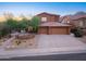 Charming home with a three-car garage, desert landscaping, and a well-manicured yard in a quiet neighborhood at 14056 E Desert Cove Ave, Scottsdale, AZ 85259