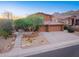 Charming two-story home featuring a three-car garage and low-maintenance desert landscaping at 14056 E Desert Cove Ave, Scottsdale, AZ 85259