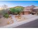 Charming two-story home featuring a three-car garage and low-maintenance desert landscaping at 14056 E Desert Cove Ave, Scottsdale, AZ 85259