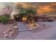 Charming desert home showcasing unique cactus landscaping and a welcoming front entrance at 14056 E Desert Cove Ave, Scottsdale, AZ 85259