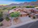 Charming desert home showcasing mountain views, mature trees, and a well-manicured yard at 14056 E Desert Cove Ave, Scottsdale, AZ 85259