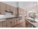 Well-equipped kitchen with granite countertops, stainless steel appliances, and an adjacent dining area at 14056 E Desert Cove Ave, Scottsdale, AZ 85259