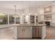 Spacious kitchen island with stainless steel dishwasher, granite countertops and pendant lighting at 14056 E Desert Cove Ave, Scottsdale, AZ 85259